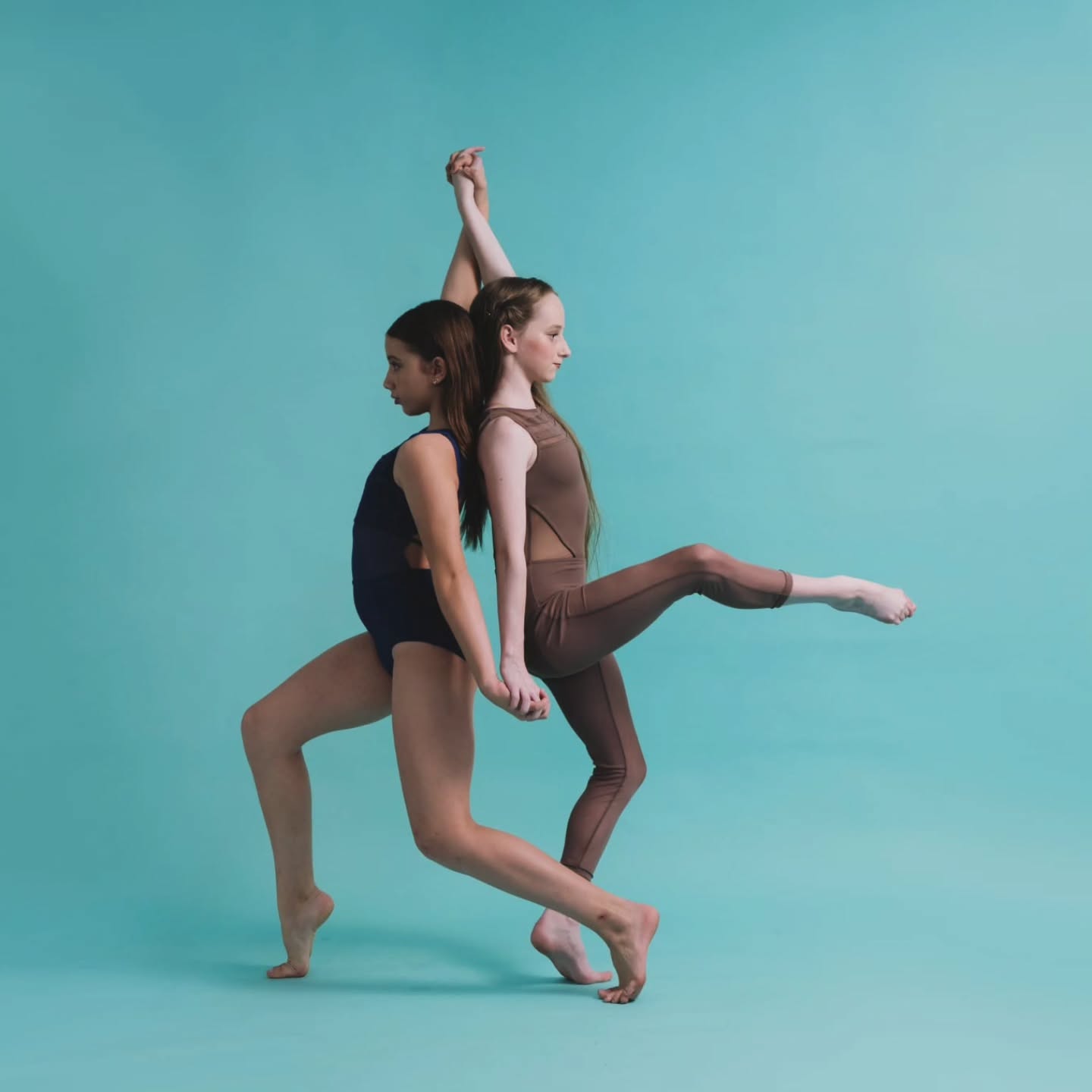 Two Australian Youth Arts Productions dancers holding a balanced pose