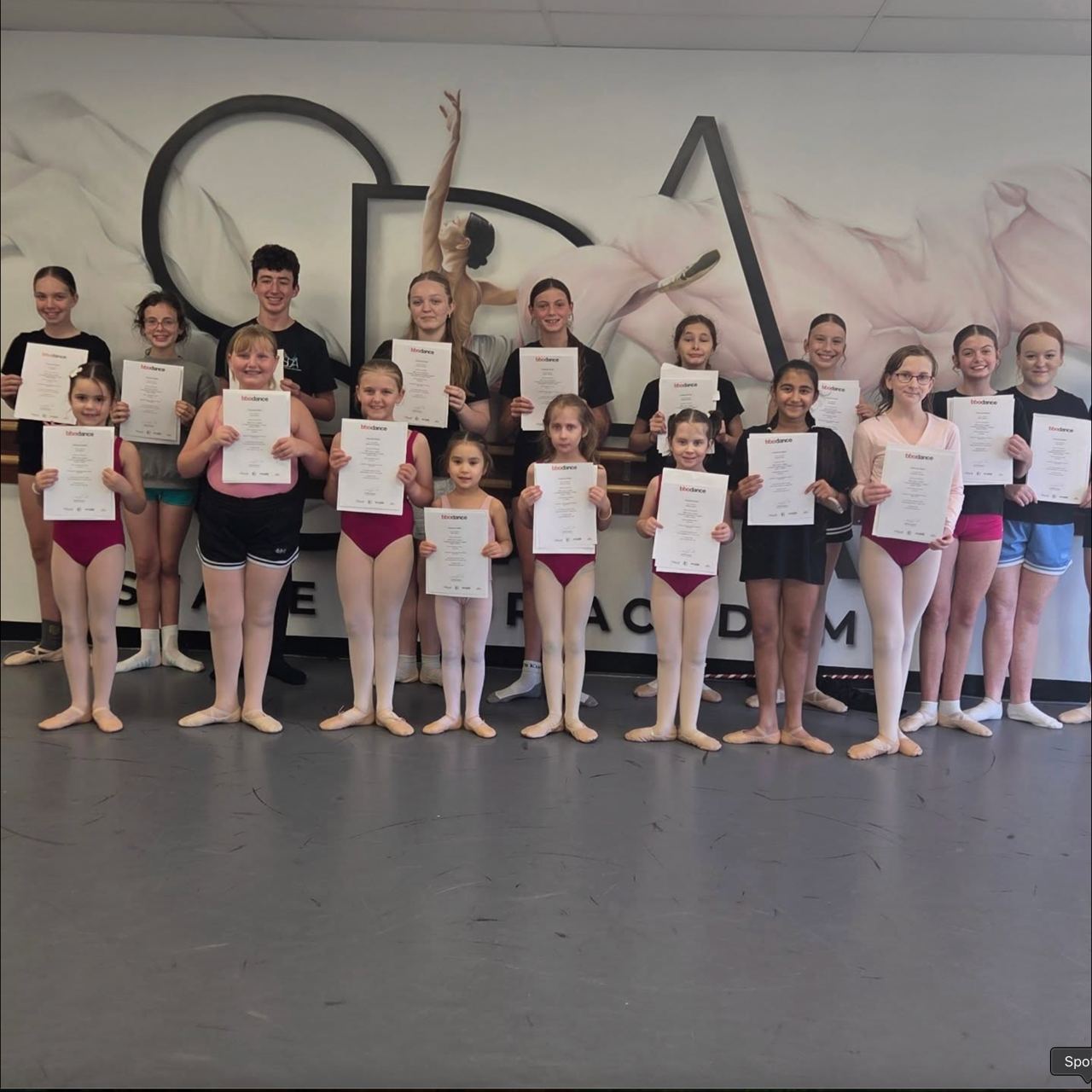 Stage Door Academy ballet students celebrating exam results with certificates